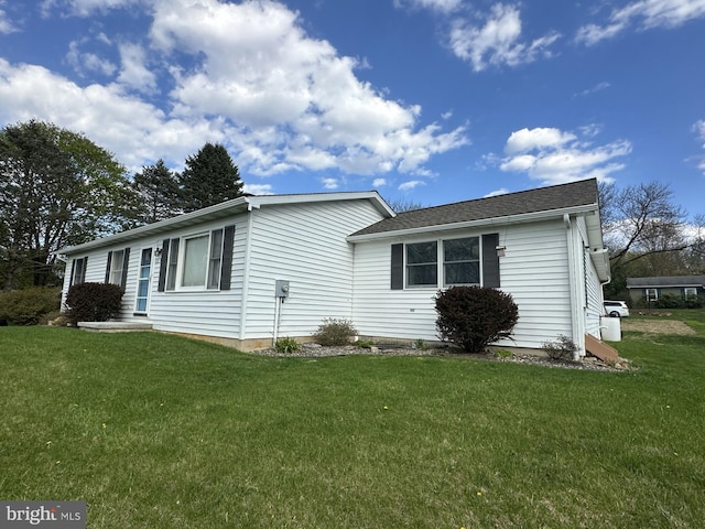 view of home's exterior featuring a lawn
