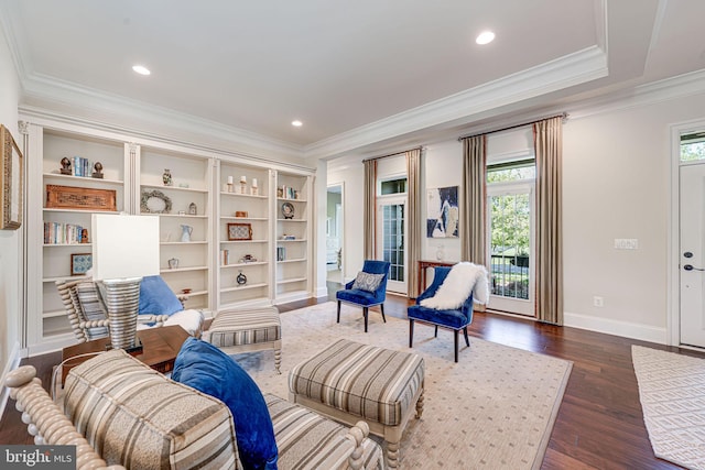 living area featuring dark wood-style flooring, baseboards, ornamental molding, and recessed lighting
