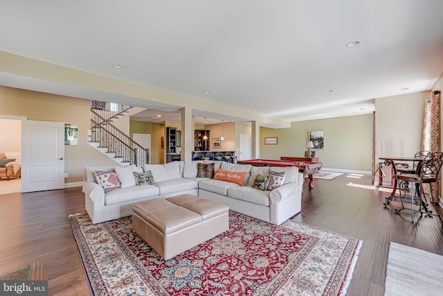living room with baseboards, dark wood-style flooring, pool table, and stairs
