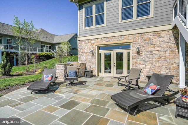 view of patio featuring french doors and a grill