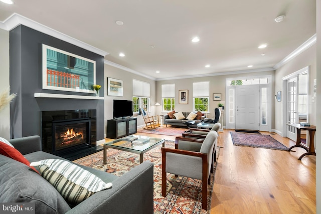 57 Primrose Hill Ln, Annapolis, MD 21403 - living room with a fireplace with flush hearth, baseboards, recessed lighting, wood finished floors, and crown molding