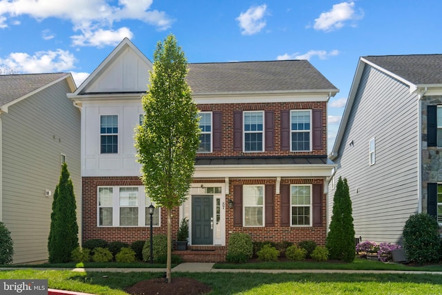 57 Primrose Hill Ln, Annapolis, MD 21403 - view of front of house featuring brick siding, board and batten siding, and a front yard
