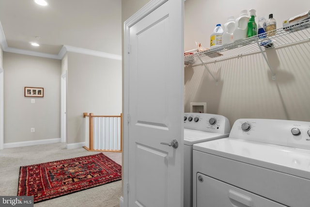 57 Primrose Hill Ln, Annapolis, MD 21403 - laundry room with baseboards, light colored carpet, separate washer and dryer, crown molding, and laundry area