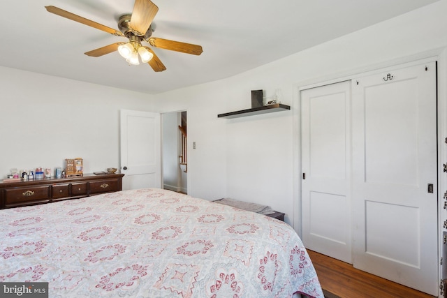 bedroom featuring a closet, a ceiling fan, and wood finished floors