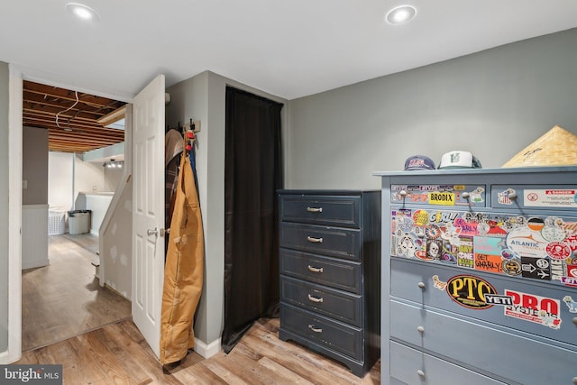 bedroom with light wood-style floors, baseboards, and recessed lighting