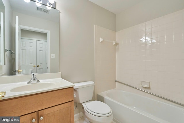 full bath with toilet, visible vents, washtub / shower combination, and vanity