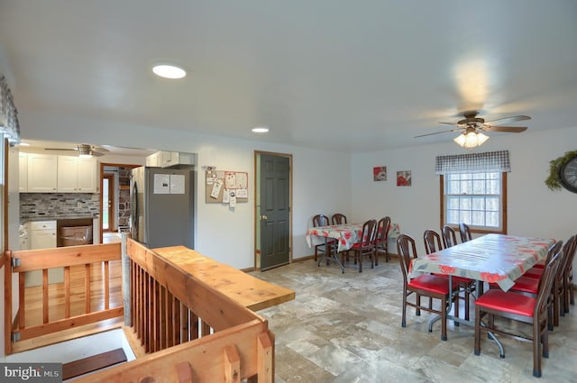 dining area featuring recessed lighting, stone finish flooring, and ceiling fan