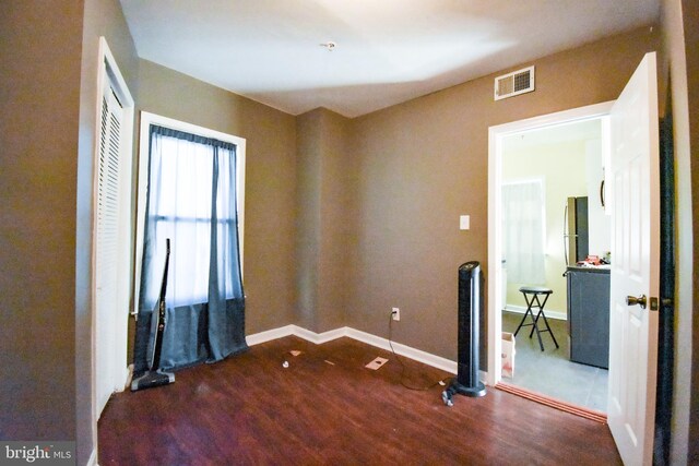 1921 Rhode Island Ave NE, Washington, DC 20018 - empty room featuring wood finished floors, visible vents, and baseboards