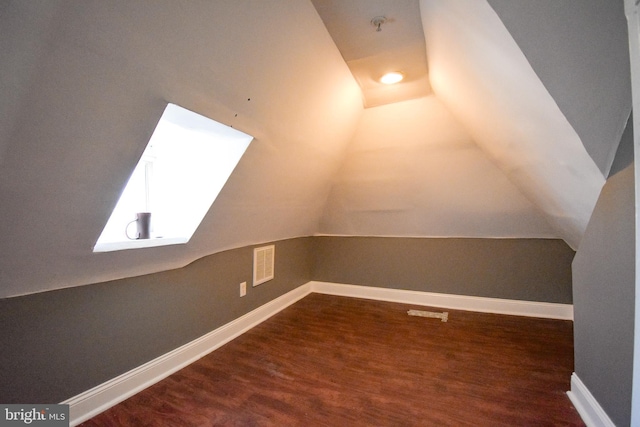 1921 Rhode Island Ave NE, Washington, DC 20018 - bonus room with lofted ceiling, baseboards, visible vents, and dark wood finished floors