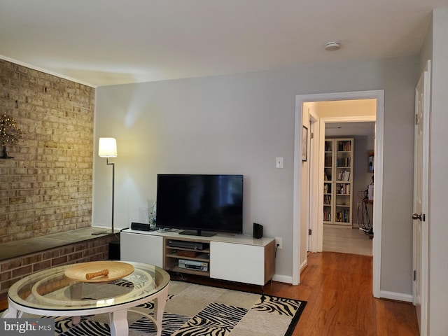living area with baseboards and light wood-style flooring