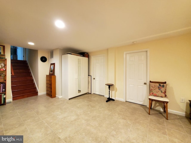 unfurnished room with visible vents, stairway, baseboards, recessed lighting, and light tile patterned flooring