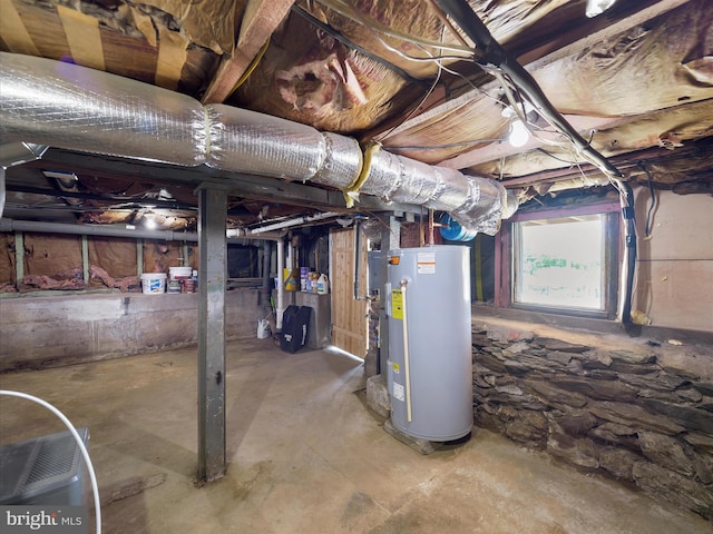 below grade area featuring water heater