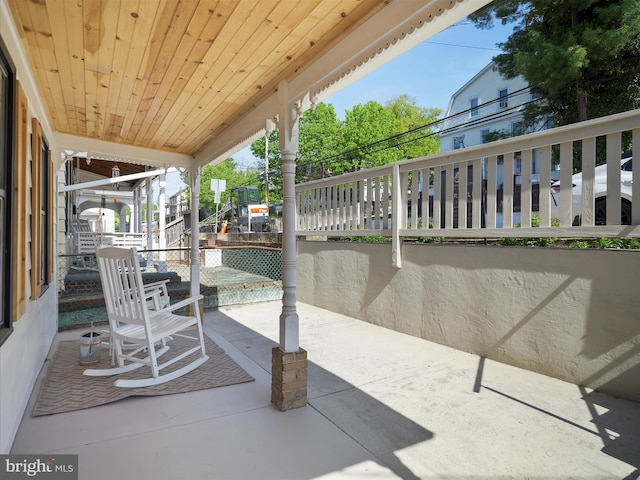 view of patio featuring fence