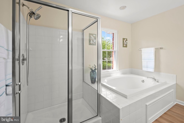 13423 Fairland Park Dr, Silver Spring, MD 20904 - full bath with wood finished floors, a bath, and a shower stall