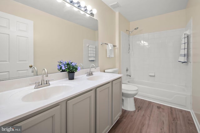 13423 Fairland Park Dr, Silver Spring, MD 20904 - full bath featuring visible vents, a sink, wood finished floors, and toilet