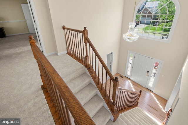 13423 Fairland Park Dr, Silver Spring, MD 20904 - carpeted entrance foyer featuring baseboards, a high ceiling, and wood finished floors