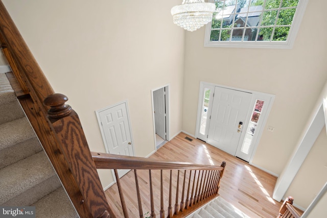 13423 Fairland Park Dr, Silver Spring, MD 20904 - foyer featuring a towering ceiling, a chandelier, and a wealth of natural light
