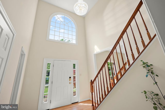 13423 Fairland Park Dr, Silver Spring, MD 20904 - foyer with a notable chandelier, a high ceiling, a wealth of natural light, and stairway