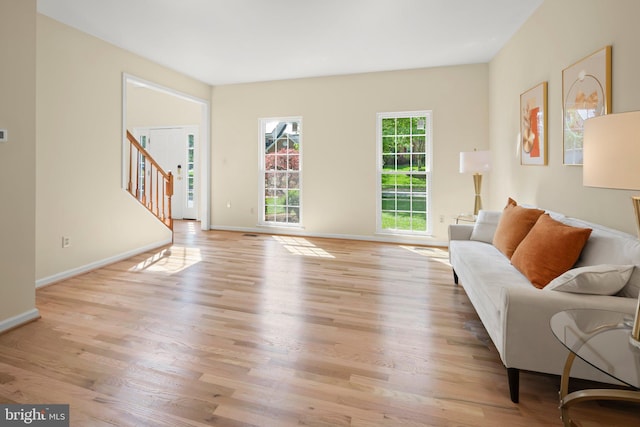 13423 Fairland Park Dr, Silver Spring, MD 20904 - living room with light wood-style floors, stairs, and baseboards