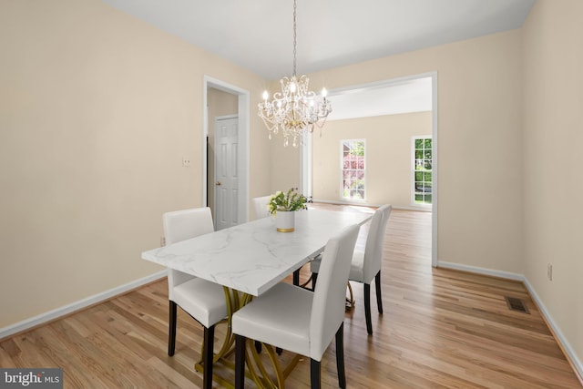 13423 Fairland Park Dr, Silver Spring, MD 20904 - dining room with baseboards, a notable chandelier, light wood-type flooring, and visible vents