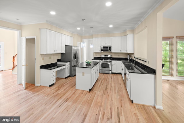 13423 Fairland Park Dr, Silver Spring, MD 20904 - kitchen featuring dark countertops, a sink, ornamental molding, stainless steel appliances, and white cabinetry