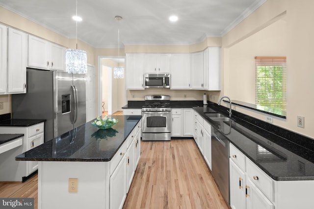 13423 Fairland Park Dr, Silver Spring, MD 20904 - kitchen with appliances with stainless steel finishes, a sink, white cabinets, a chandelier, and light wood-style floors