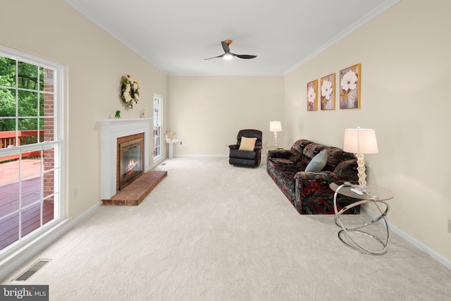 13423 Fairland Park Dr, Silver Spring, MD 20904 - carpeted living room featuring visible vents, ornamental molding, a brick fireplace, baseboards, and ceiling fan
