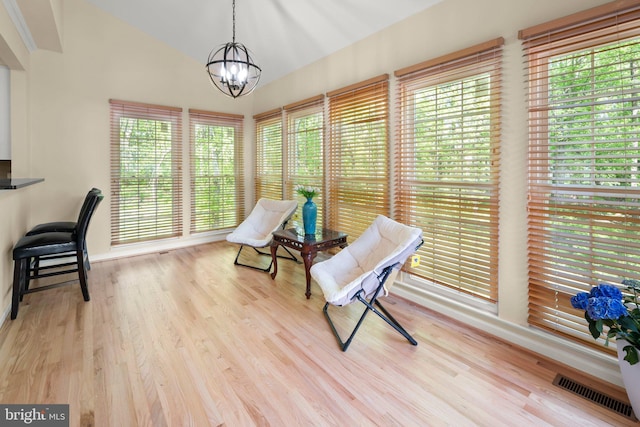 13423 Fairland Park Dr, Silver Spring, MD 20904 - living area with visible vents, lofted ceiling, wood finished floors, and a notable chandelier