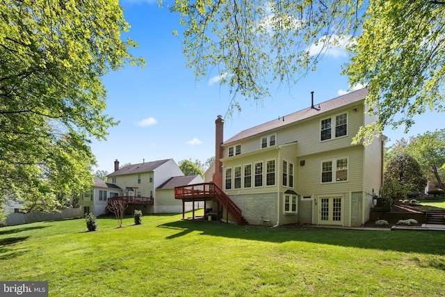 13423 Fairland Park Dr, Silver Spring, MD 20904 - back of property with a wooden deck, french doors, a chimney, a lawn, and stairway