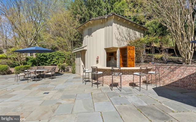 view of patio with outdoor dry bar