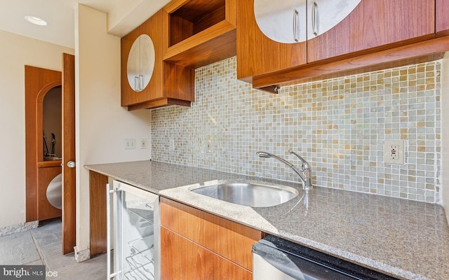 kitchen featuring decorative backsplash, a sink, beverage cooler, light stone countertops, and dishwasher