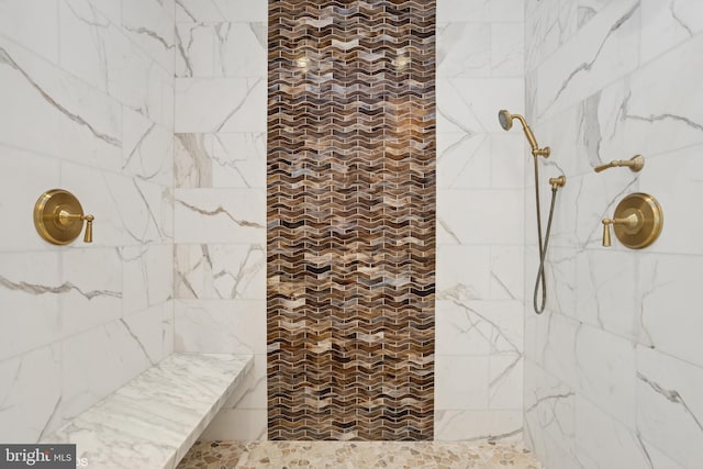 full bath featuring tiled shower