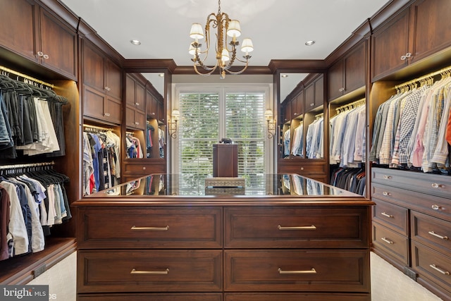 spacious closet featuring a notable chandelier