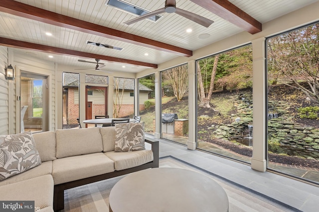 sunroom / solarium featuring an outdoor hangout area, a ceiling fan, and beamed ceiling