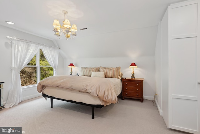 bedroom with a chandelier, lofted ceiling, visible vents, baseboards, and light colored carpet
