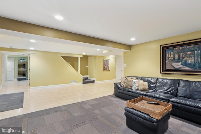 living area featuring beverage cooler, wood finished floors, stairs, and recessed lighting