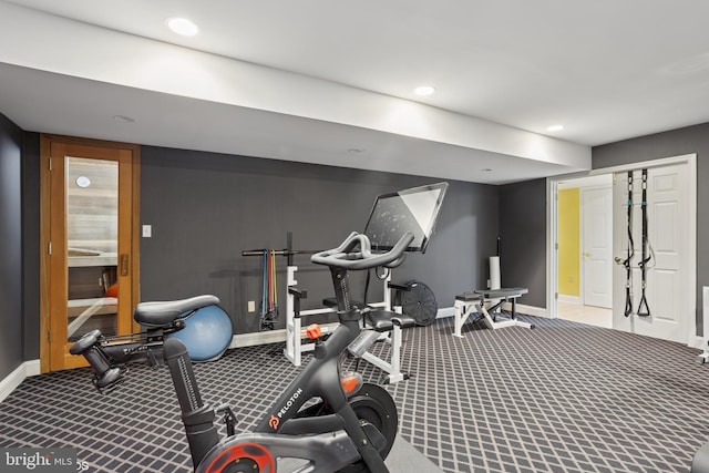 exercise area with baseboards, recessed lighting, and carpet