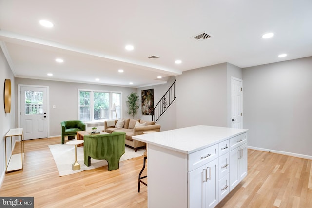3306 Landover St, Alexandria, VA 22305 - living room with stairs, light wood-type flooring, radiator, recessed lighting, and baseboards