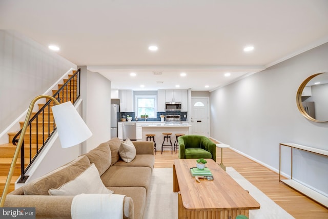 3306 Landover St, Alexandria, VA 22305 - living area featuring light wood-type flooring, stairway, baseboards, and recessed lighting