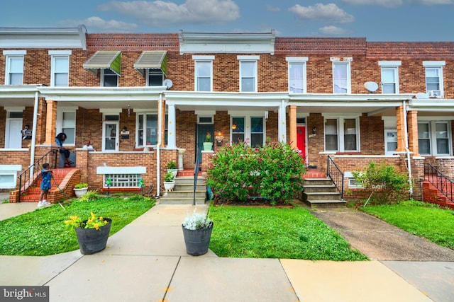 2744 Pelham Ave, Baltimore, MD 21213 - multi unit property featuring covered porch, brick siding, and stairway