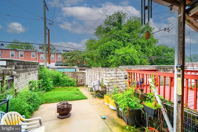 2744 Pelham Ave, Baltimore, MD 21213 - fenced backyard with a fire pit and a patio area