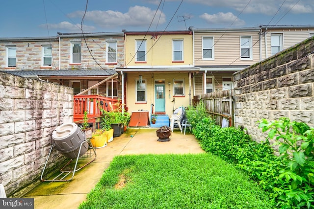 2744 Pelham Ave, Baltimore, MD 21213 - back of property featuring a patio, a fenced backyard, and an outdoor fire pit