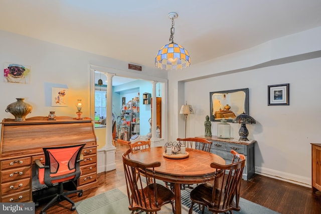 2744 Pelham Ave, Baltimore, MD 21213 - dining area with decorative columns and wood finished floors