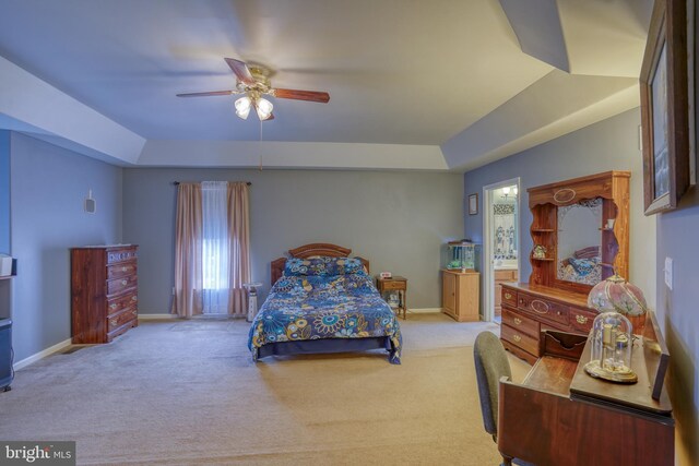 bedroom with a ceiling fan, baseboards, and carpet