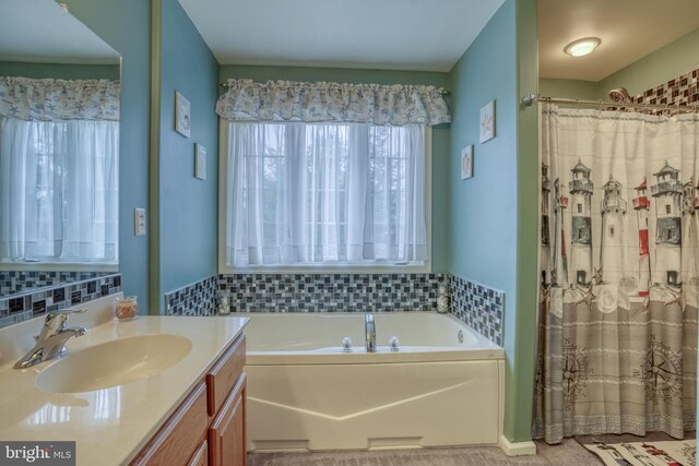 full bath with a garden tub, vanity, and a shower with shower curtain