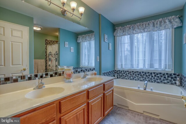 full bathroom with a garden tub, double vanity, and a sink