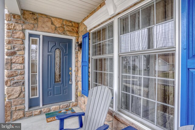 view of exterior entry with stone siding