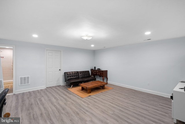 sitting room featuring baseboards, recessed lighting, wood finished floors, and visible vents