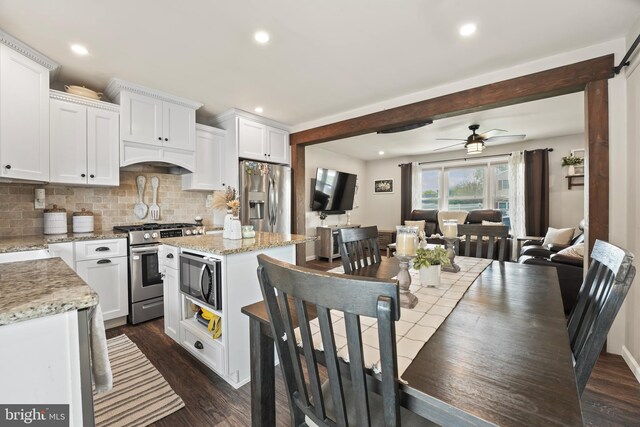 16 Century Way, Hamilton, NJ 08690 - kitchen with white cabinetry, stainless steel appliances, dark wood finished floors, and decorative backsplash