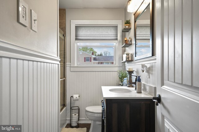 16 Century Way, Hamilton, NJ 08690 - bathroom with toilet, vanity, plenty of natural light, and wainscoting